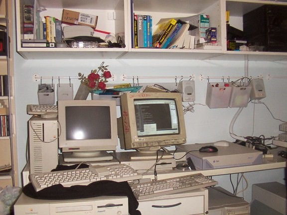 Alk&rsquo;s workstation — two CRT monitors, two keyboards, cables everywhere. This is what a &ldquo;power user&rdquo; setup looked like before ultrawide displays and Thunderbolt docks. The second monitor was a luxury.